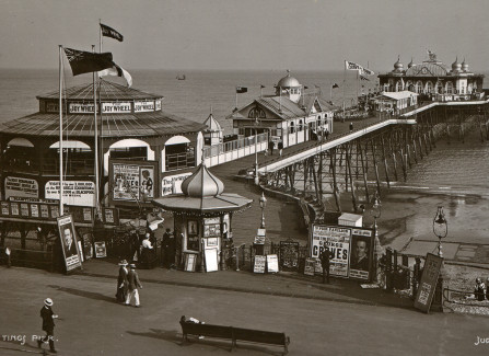 1911. Pier with Joy Wheel and shooting gallery