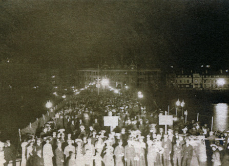 A crowd on the Pier at night