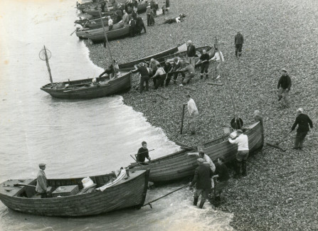 A fishing competition with boats landing on Hastings beach