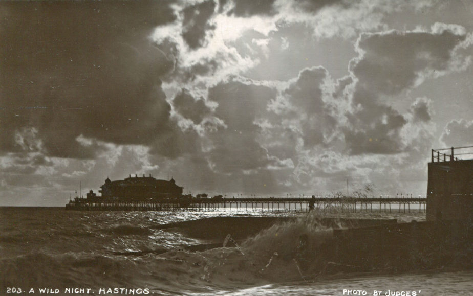 An intrepid person braves the storm in this dramatic picture of Hastings Pier on a wild night.