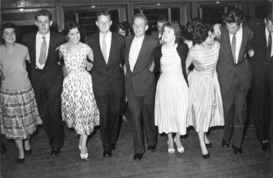 Brenda Elliott, Brian Elliott, Rolly, Wendy, Arthur and Shirley. Brian and Brenda are fifth and sixth from the left; when this photograph was taken they were not yet married. A 1950s photograph by Pier photographer Gifford Boyd. 
